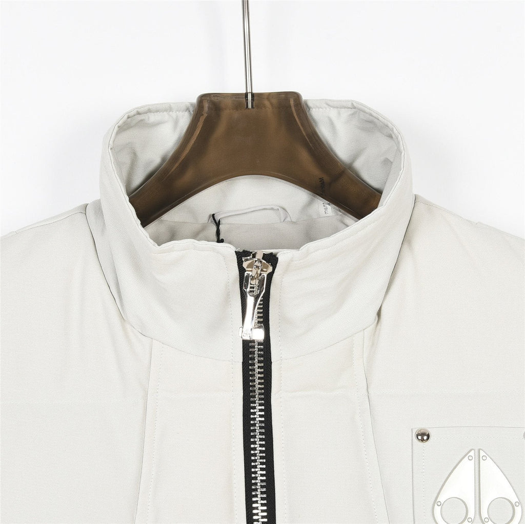 Moose Knuckles Down Vest — Metal Handcuff Badge, Silver Studs, Dual Pockets (Black / White)