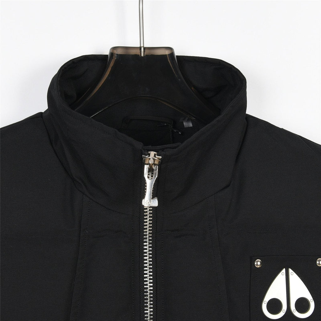 Moose Knuckles Down Vest — Metal Handcuff Badge, Silver Studs, Dual Pockets (Black / White)