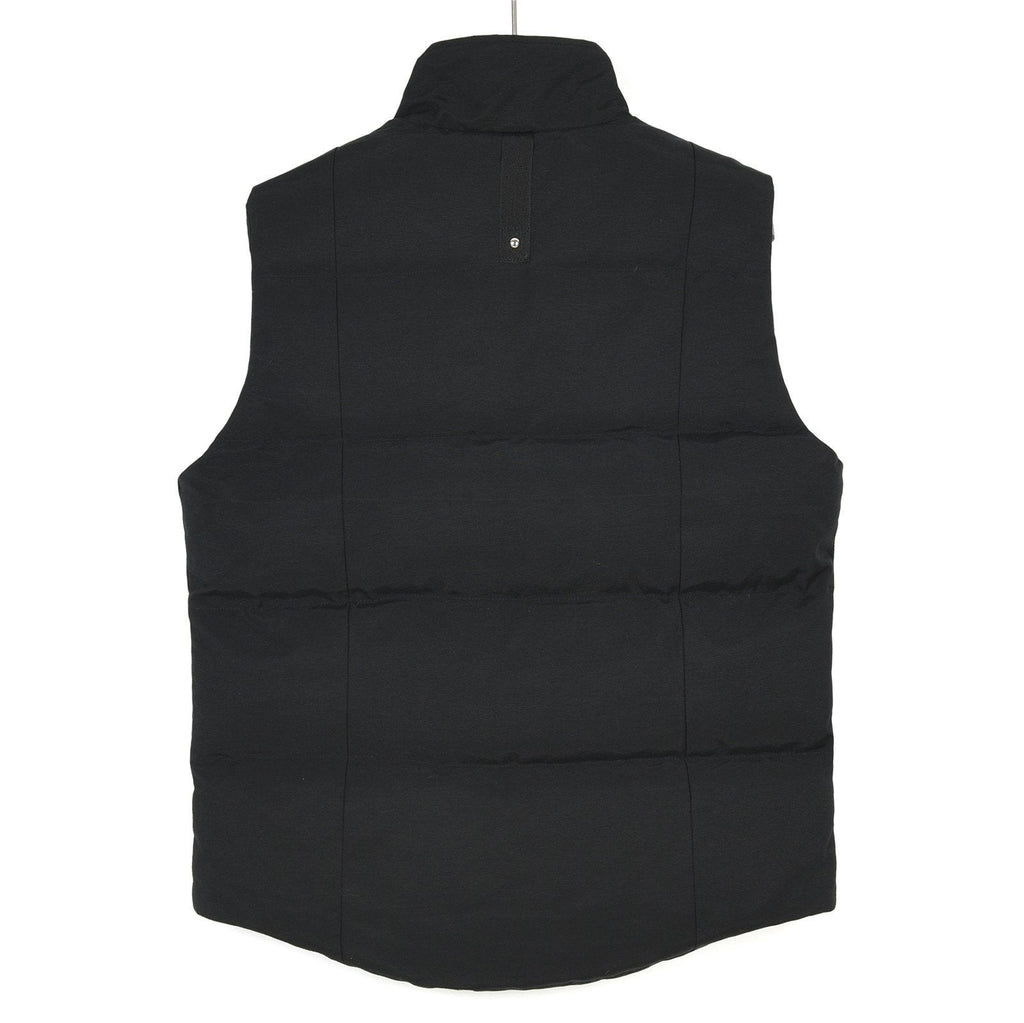Moose Knuckles Down Vest — Metal Handcuff Badge, Silver Studs, Dual Pockets (Black / White)