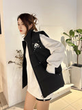 Moose Knuckles Down Vest — Metal Handcuff Badge, Silver Studs, Dual Pockets (Black / White)